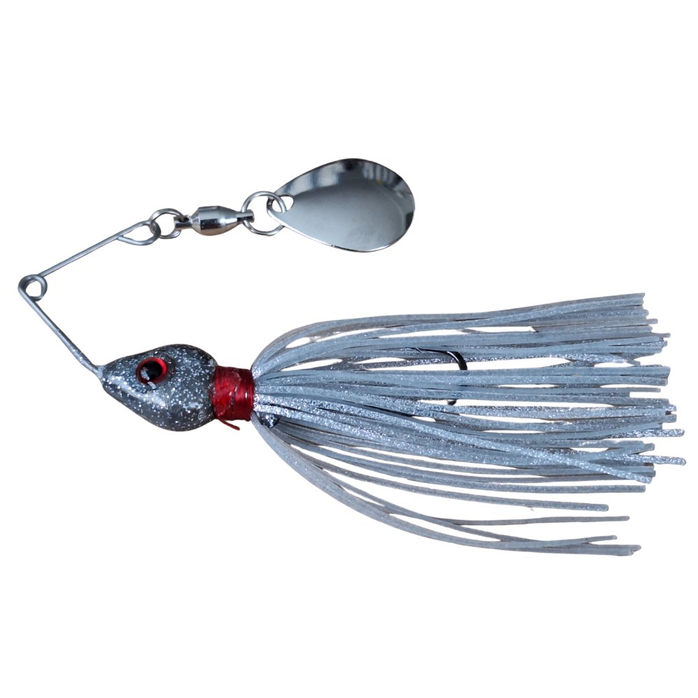 Fishing lure with a silver blade and white and silver skirt on a white background